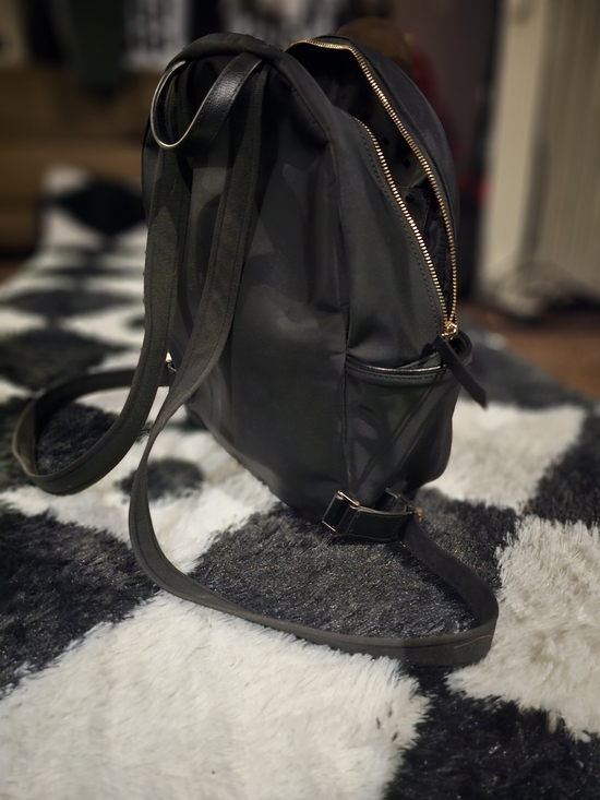 kate spade black backpack with gold hardware